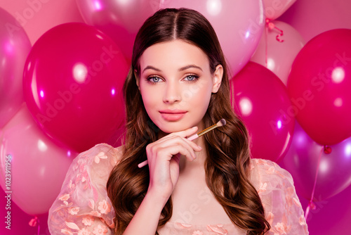 Photo of stunning lovely girl holding brush preparing for prom festive ceremony on pink color background