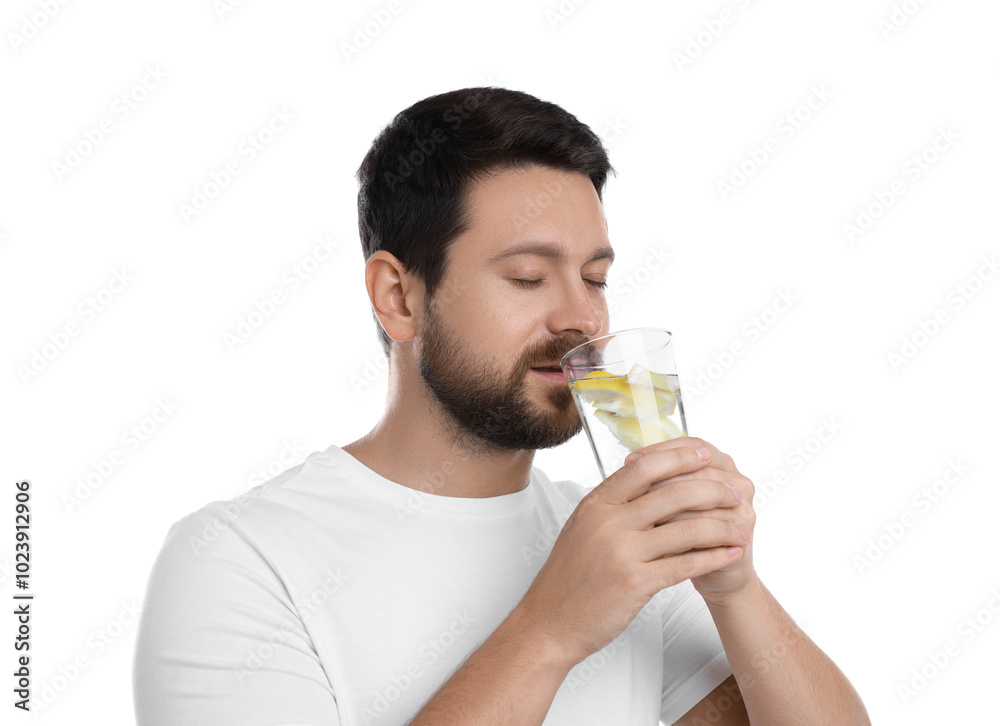 Handsome man drinking water with lemon on white background Handsome man drinking water with lemon on white background