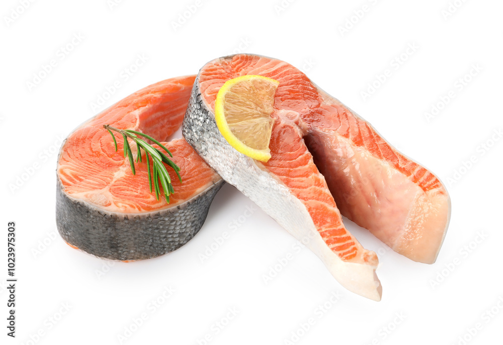 Two fresh salmon steaks, lemon and rosemary isolated on white Two fresh salmon steaks, lemon and rosemary isolated on white