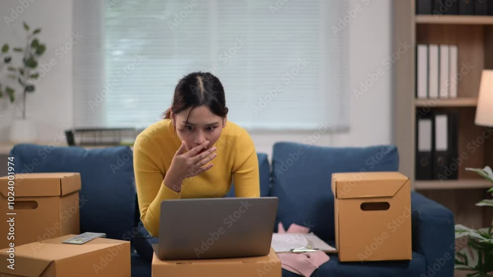 Young entrepreneur celebrating success while working from home Young entrepreneur celebrating success while working from home