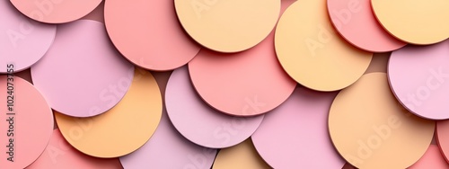 Overlapping pastel circles in various shades of pink, yellow, and orange