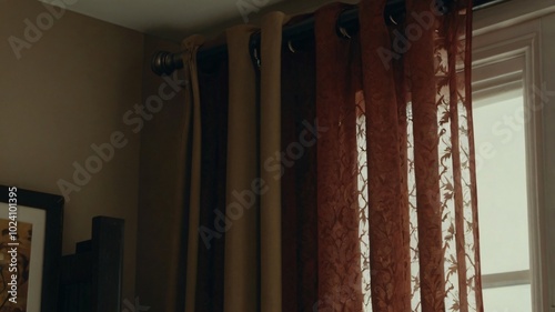 Sunlight streaming through decorative curtains in a cozy interior setting during the late afternoon
