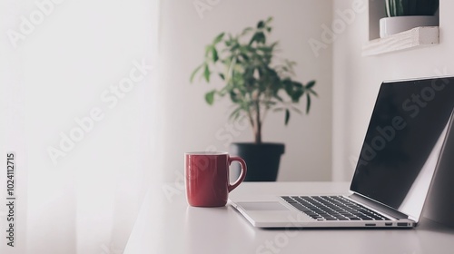 Cozy Workspace with Laptop and Plant