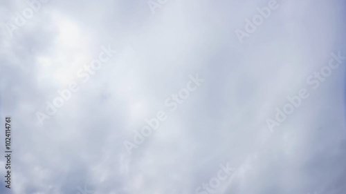 Bright blue sky with fluffy white clouds on a clear sunny day