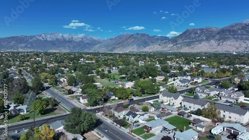 Aerial American Fork Utah residential neighborhood pull 1. Mount Timpanogos. Utah city. Economic center for residential retail shopping. Growing population, homes, business and schools. Neighborhood. photo