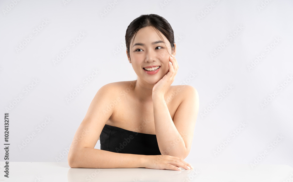 Portrait of a beautiful Asian girl posing for beauty on a white background Portrait of a beautiful Asian girl posing for beauty on a white background