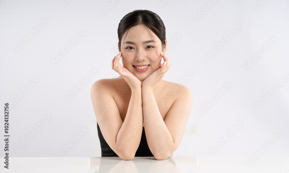 Portrait of a beautiful Asian girl posing for beauty on a white background Portrait of a beautiful Asian girl posing for beauty on a white background