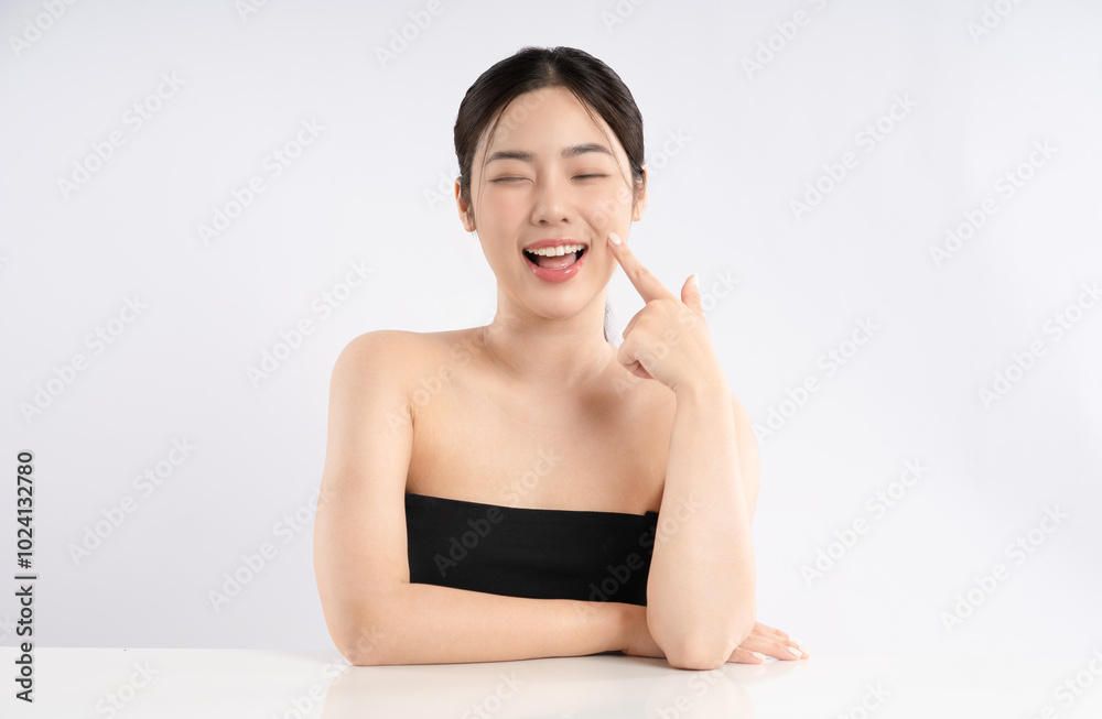 Portrait of a beautiful Asian girl posing for beauty on a white background Portrait of a beautiful Asian girl posing for beauty on a white background