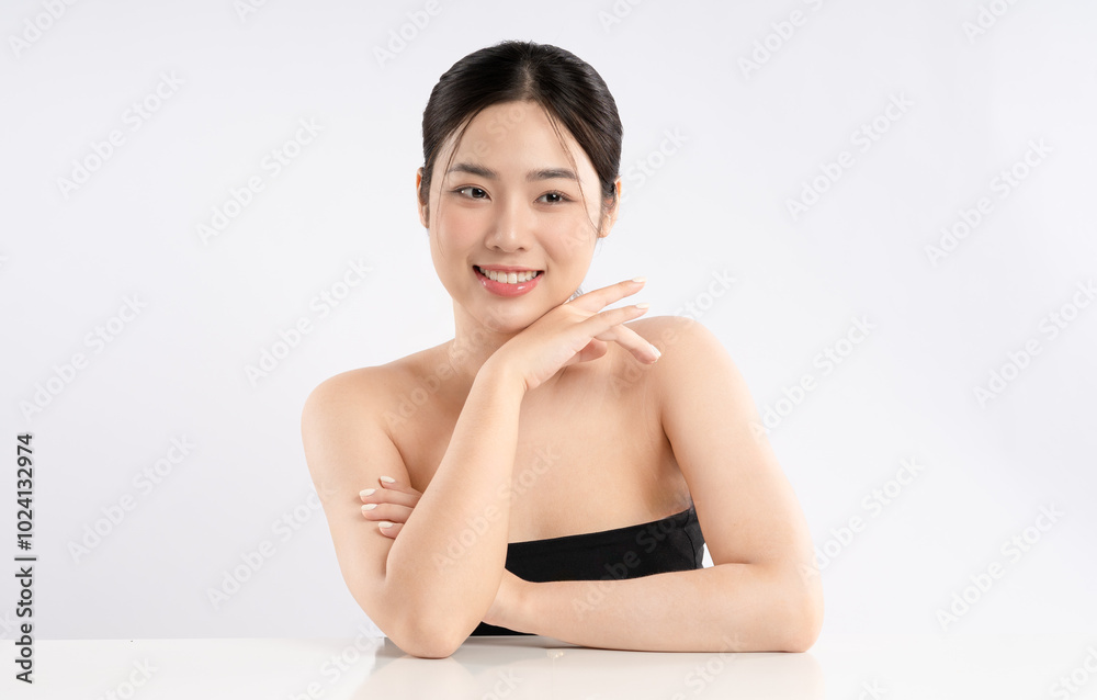 Portrait of a beautiful Asian girl posing for beauty on a white background Portrait of a beautiful Asian girl posing for beauty on a white background