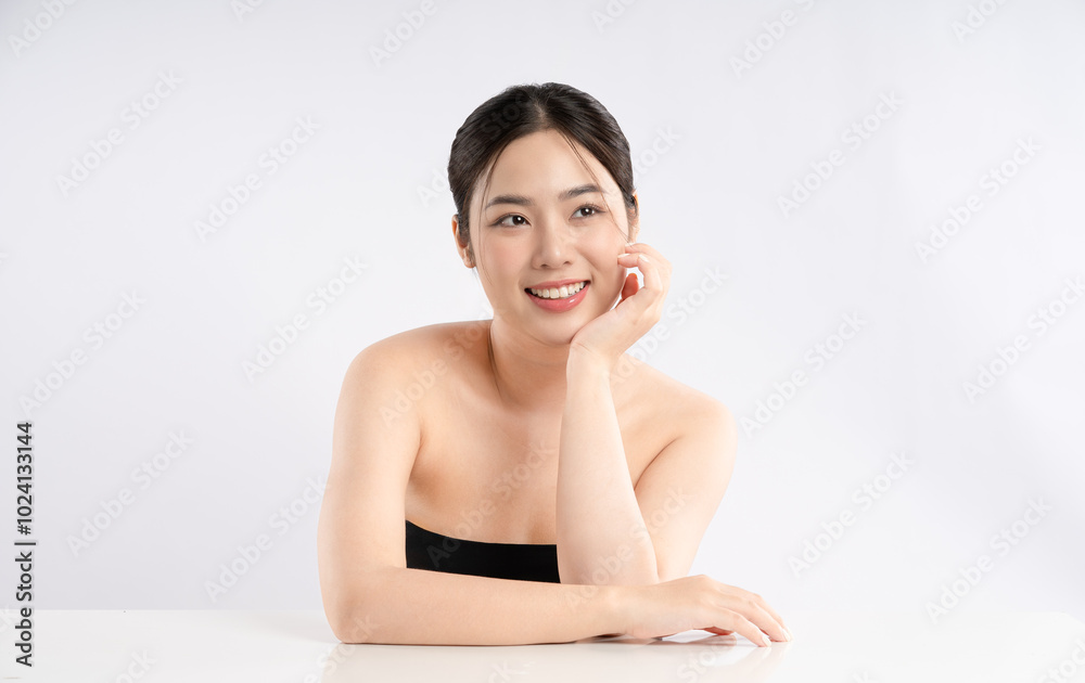 Portrait of a beautiful Asian girl posing for beauty on a white background Portrait of a beautiful Asian girl posing for beauty on a white background