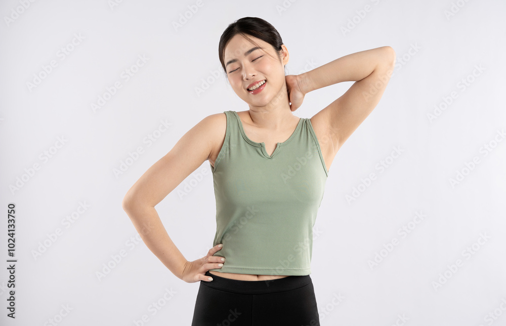 Image of young Asian girl wearing sportswear posing on white background
Image of young Asian girl wearing sportswear posing on white background