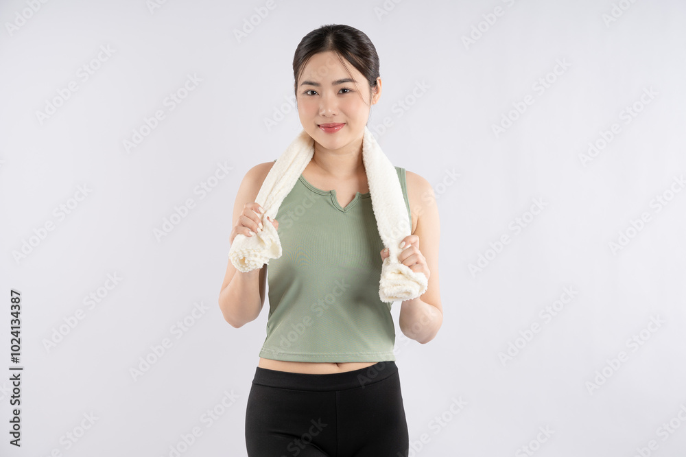 Image of young Asian girl wearing sportswear posing on white background
Image of young Asian girl wearing sportswear posing on white background