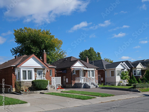 Street with small brick bungalows photo