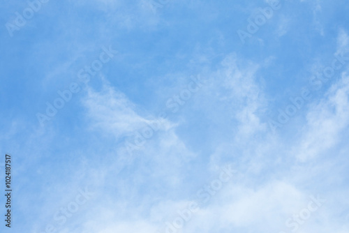 Obraz na płótnie Blue sky background and white clouds soft focus, and copy space horizontal shape. w salonie