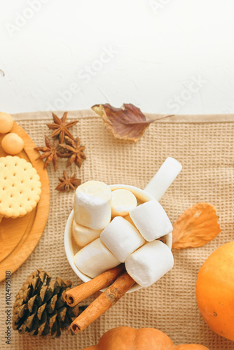 To create a warm and cozy autumn ambiance, decorate with fallthemed items and enjoy marshmallows for a festive touch