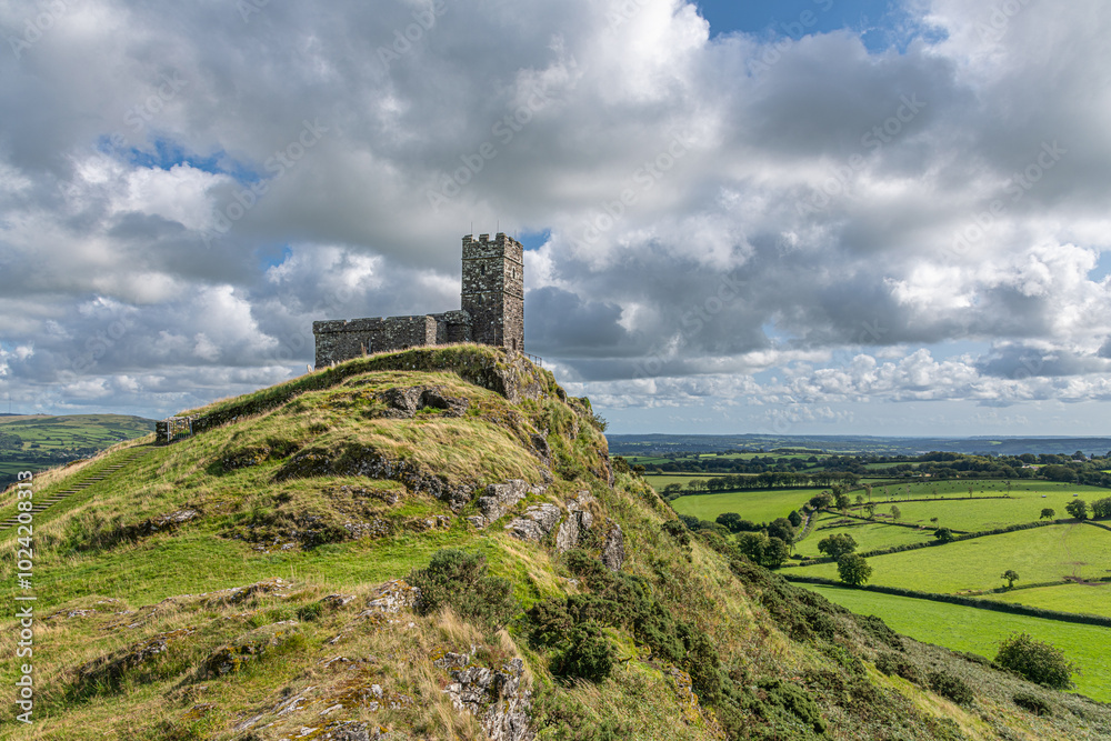 Afternoon sun shines down on the ancient church of St. Michael de Rupe in Brentor, Dartmoor Afternoon sun shines down on the ancient church of St. Michael de Rupe in Brentor, Dartmoor