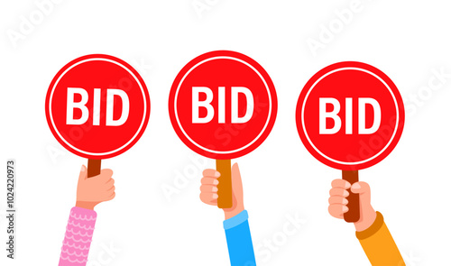 People holding bid paddles making offers at auction