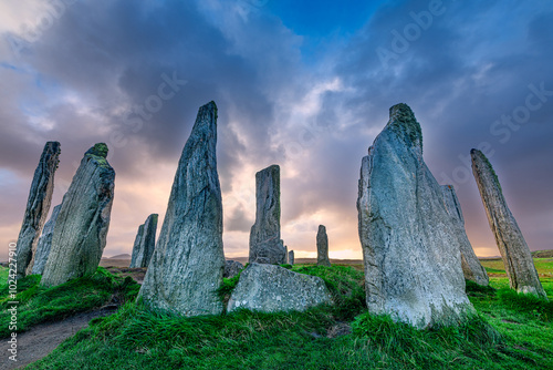 The ancient standing stones of Callanish (or Calanais) on Lewis in the Outer Hebrides of Scotland at sunset photo