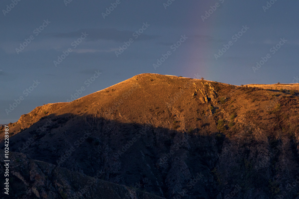 Fototapeta premium Mountain Hill with Faded Rainbow: Hurry Up and Make a Wish