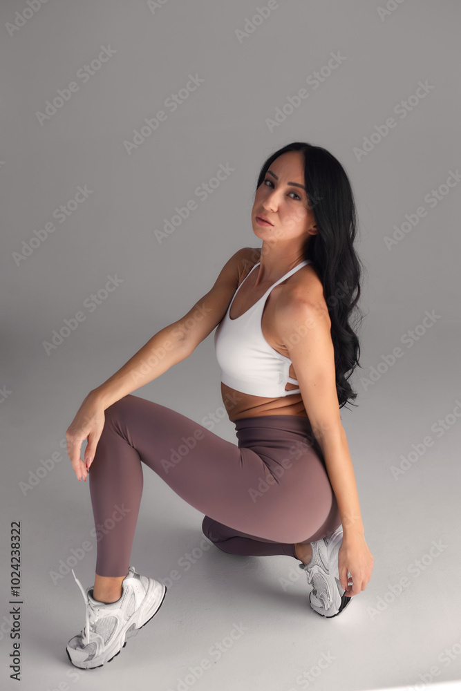 Young girl practice balance asanas isolated on white background. Concept of healthy life and natural balance between body and mental development. Full length Young girl practice balance asanas isolated on white background. Concept of healthy life and natural balance between body and mental development. Full length