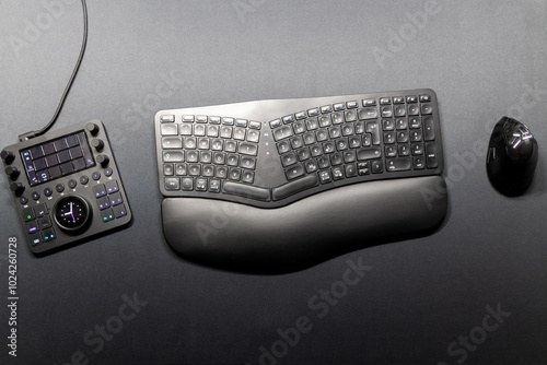 Ergonomic keyboard and ergonomic mouse as ergonomic home office equipment for freelance work and healthy workplace for notebook and clean desktop for efficient work from home for video editing graphic