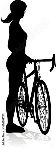 Bicyclist riding their bike and wearing a safety helmet in silhouette