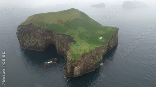 Aerial Footage of an isolated and deserted island in Iceland with a house/cottage. Filmed with a Drone. Different shots available in my portfolio.