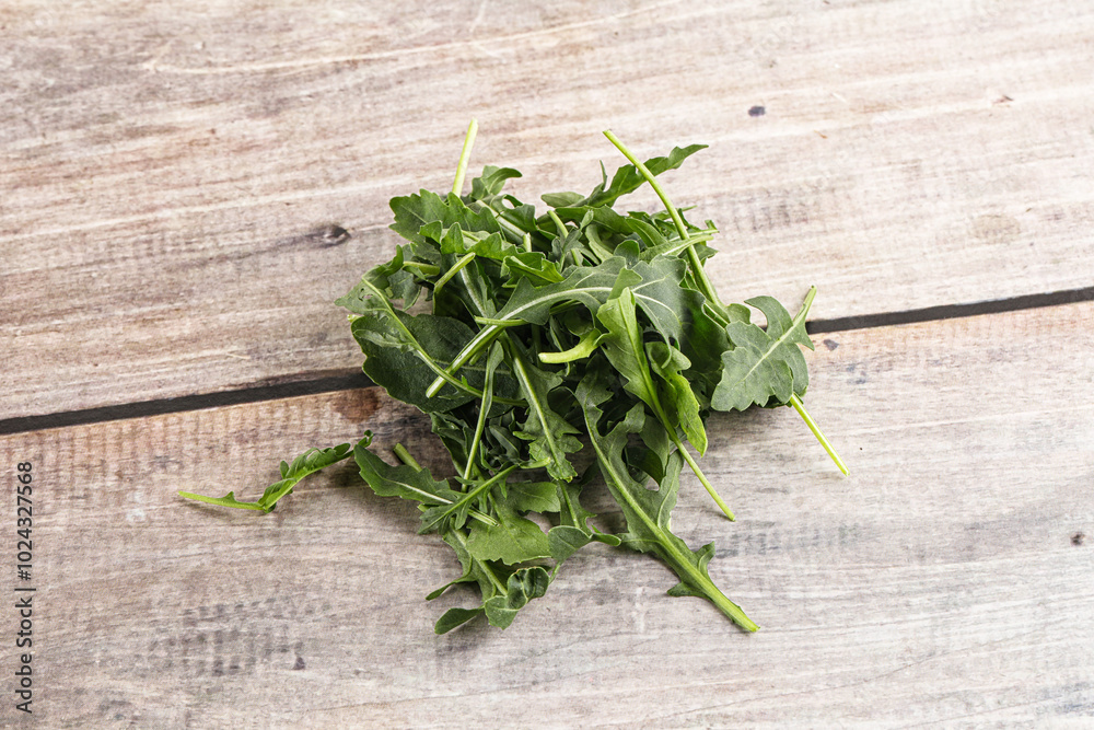 Green Arugula heap over background Green Arugula heap over background