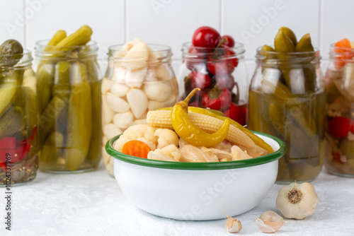 Assorted mixed pickled vegetables in bowl - plate, Turkish name; tursu. photo