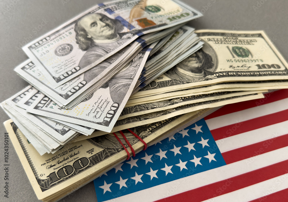 One hundred dollars banknotes on flag background