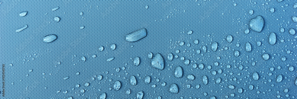 Panoramic image. Many water drops on blue background Panoramic image. Many water drops on blue background