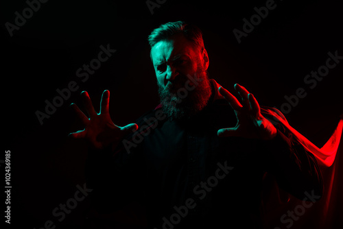 Photo of angry creepy spooky halloween male character isolated on dark misty mysterious background
