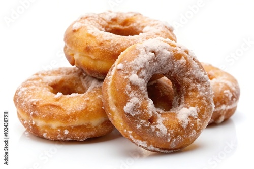 Tempting apple fritter rings coated in sugar glaze on white background with depth of field