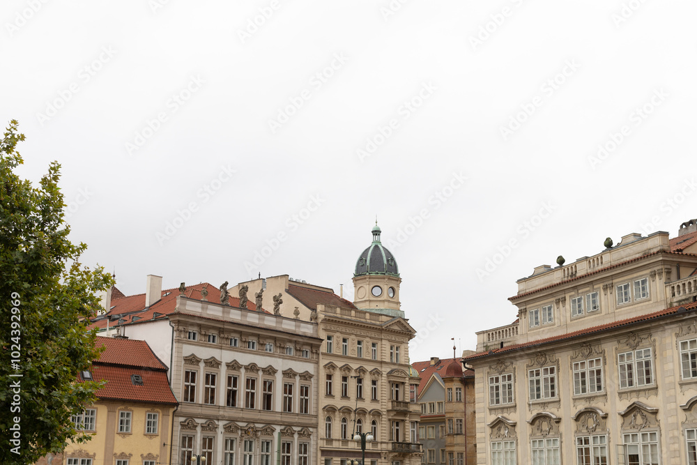 In a picturesque landscape, there is a row of beautiful buildings, and notably, one of these structures features an elegant dome on its rooftop In a picturesque landscape, there is a row of beautiful buildings, and notably, one of these structures features an elegant dome on its rooftop