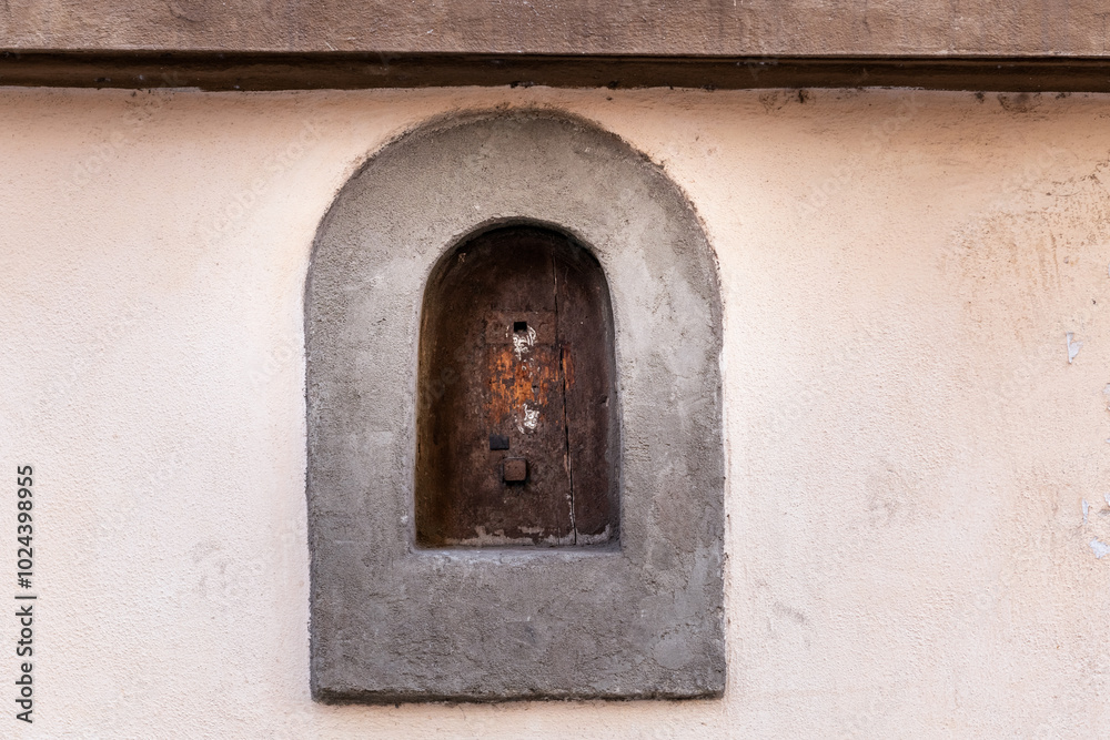 Wine window on the exterior of a building in Florence, Italy Wine window on the exterior of a building in Florence, Italy