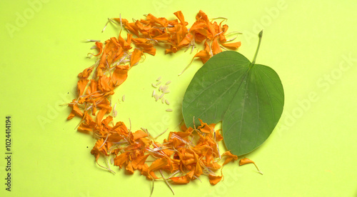 Indian Festival Dussehra, showing golden leaf and flowers with Kumkum and rice on White background. Greeting card. photo