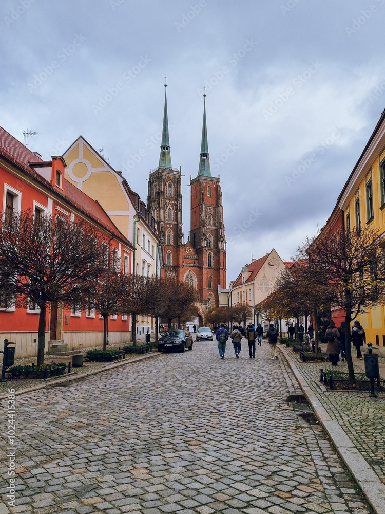 Obraz premium Street with view to Cathedral of St. John the Baptist, Tumski island, Wroclaw, Poland 