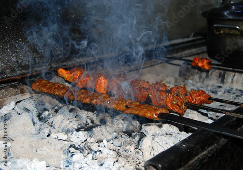 Turkish kebab on the grill and smokes
