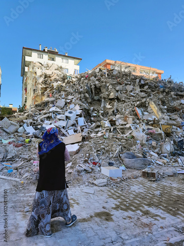 Sad woman with destroyed house