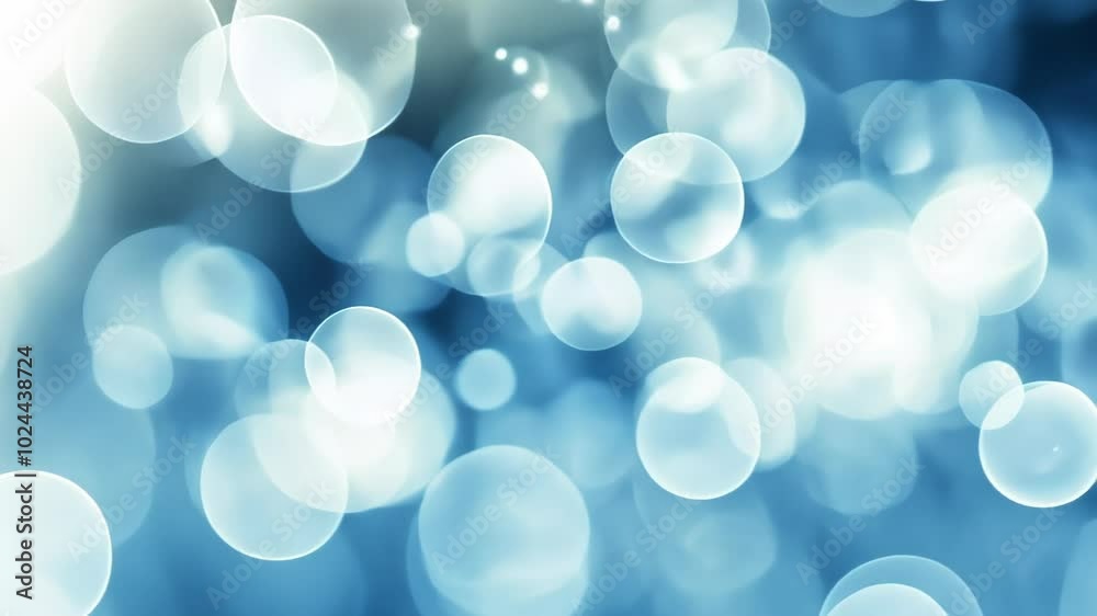 A soft-focus image featuring blue bokeh circles, creating a calming and dreamy atmosphere. A soft-focus image featuring blue bokeh circles, creating a calming and dreamy atmosphere.