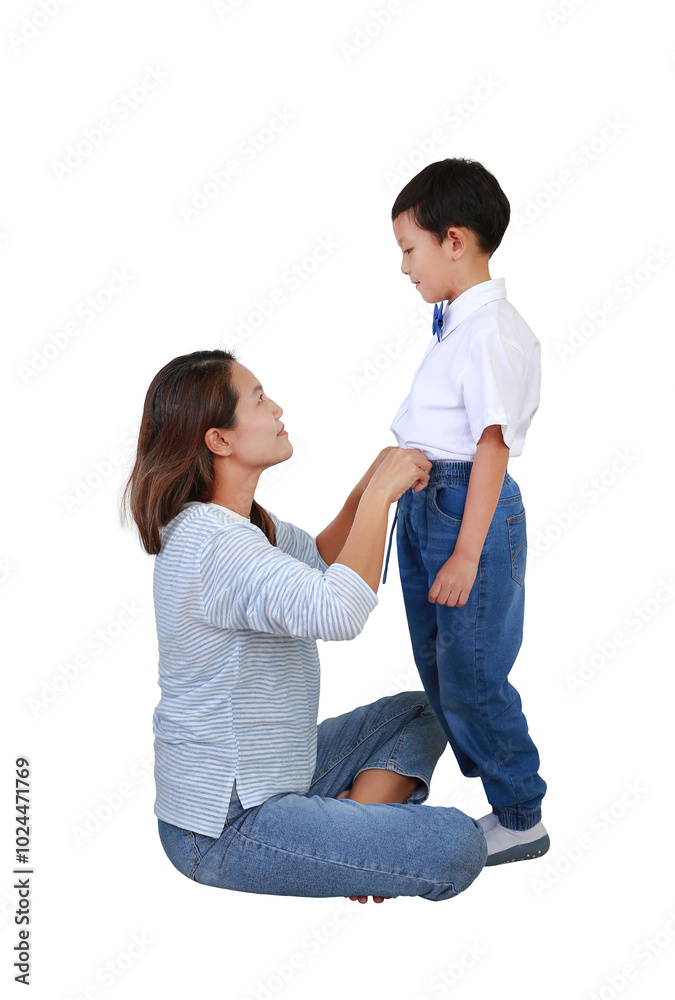 Portrait Asian mom helping son getting dressed isolated on white studio background. Image full length. Portrait Asian mom helping son getting dressed isolated on white studio background. Image full length.
