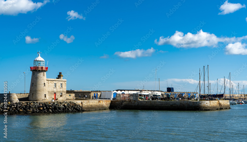 Beautiful seascape - Howth lighthouse with boat Beautiful seascape - Howth lighthouse with boat