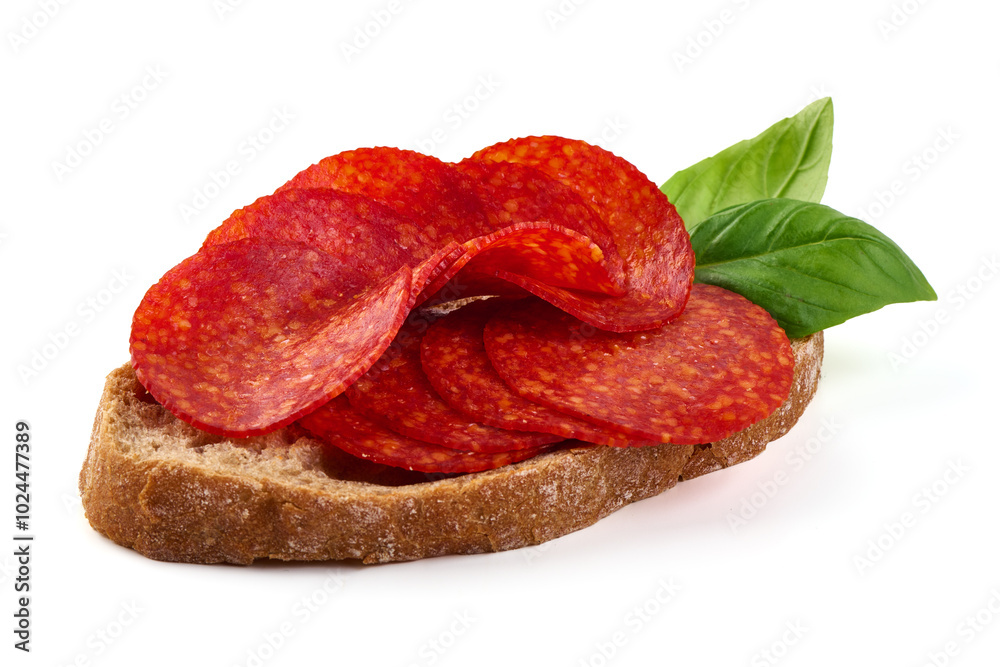 Spanish pork chorizo sausage sandwich, close-up, isolated on white background.