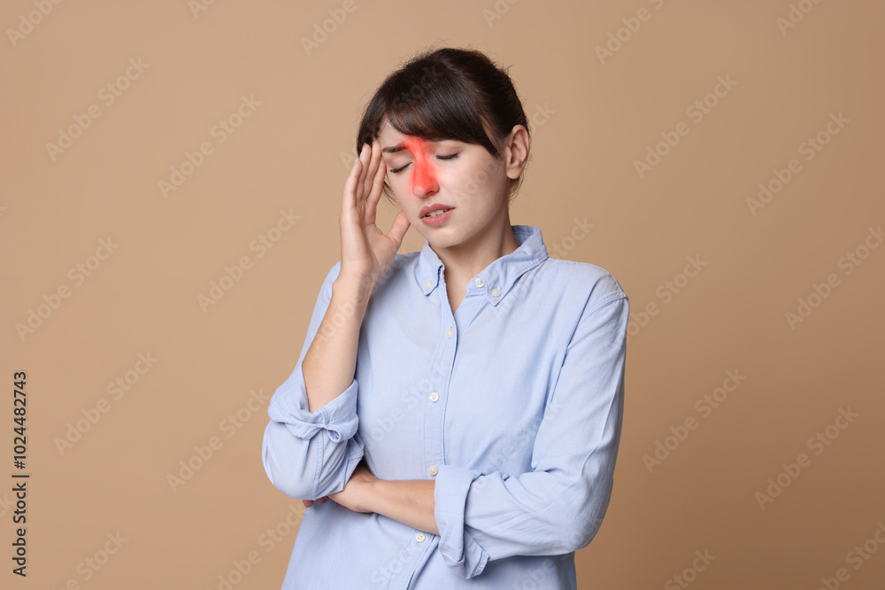Woman suffering from sinusitis on dark beige background Woman suffering from sinusitis on dark beige background