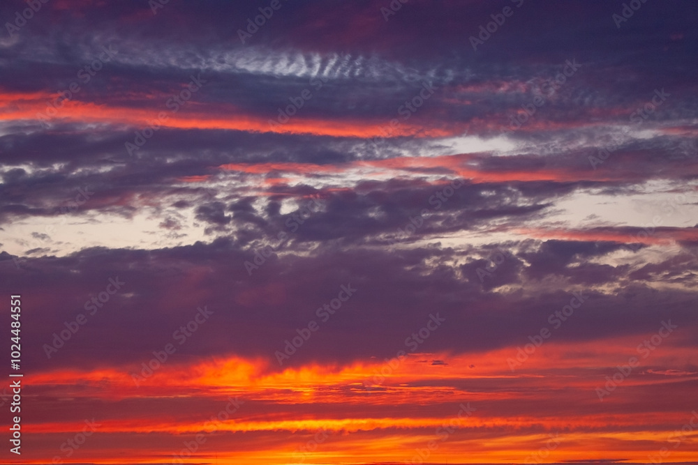 A beautiful sunset with a purple sky and clouds A beautiful sunset with a purple sky and clouds