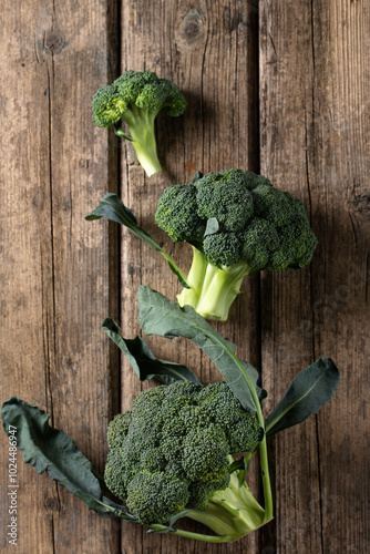 Fresh green heads of broccoli cabbage on vintage table