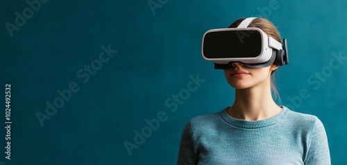 Woman wearing virtual reality headset, focused on immersive experience.