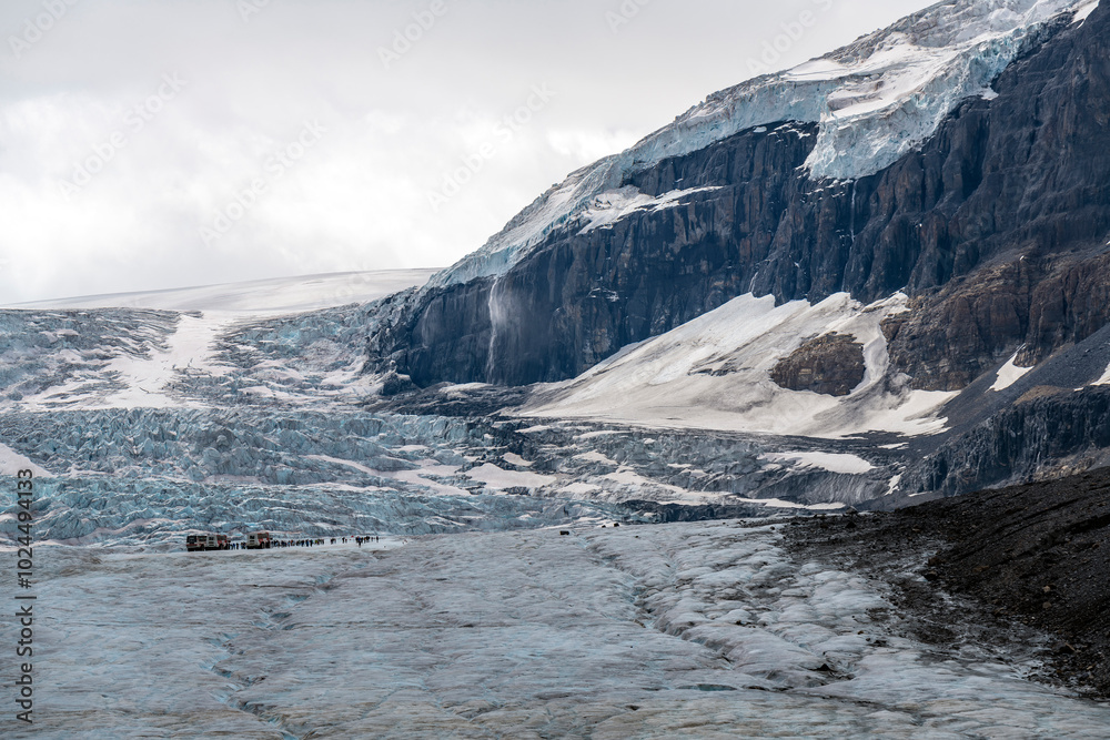 Athabasca glacier with people and Columbia icefield vehicle, Jasper national park, Canada. Athabasca glacier with people and Columbia icefield vehicle, Jasper national park, Canada.