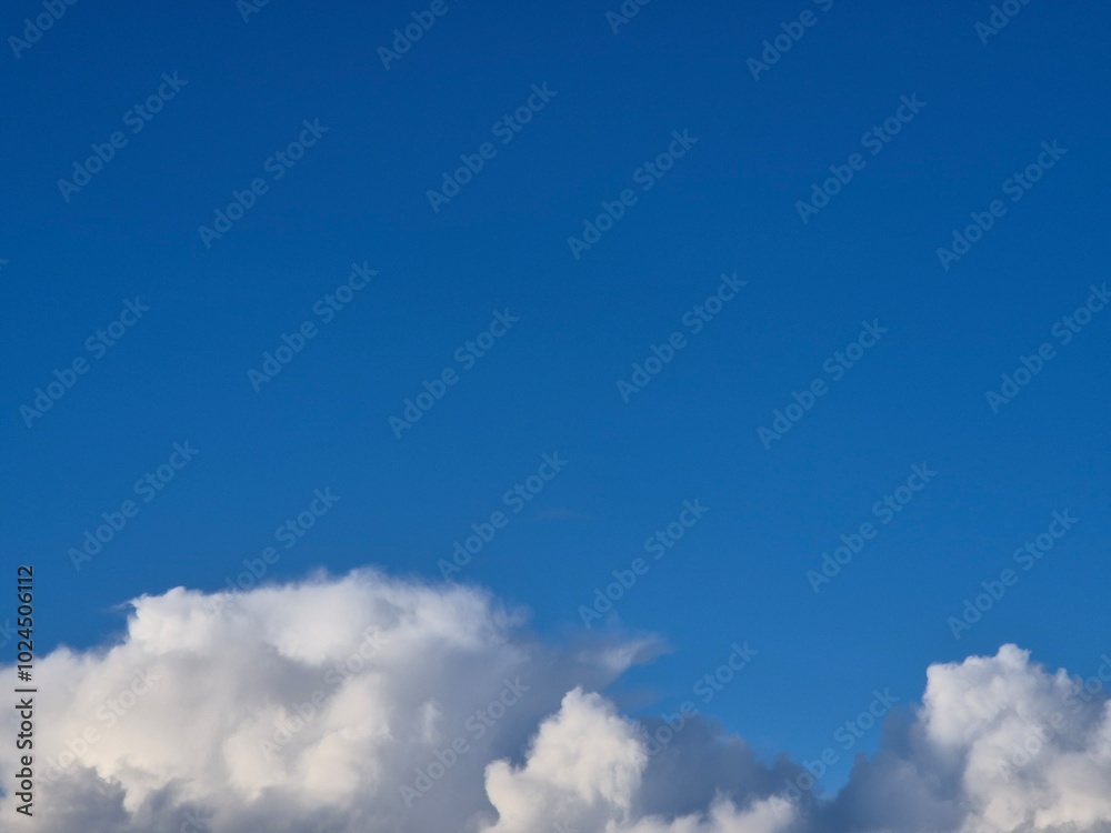 Obraz premium White clouds in summer sky background