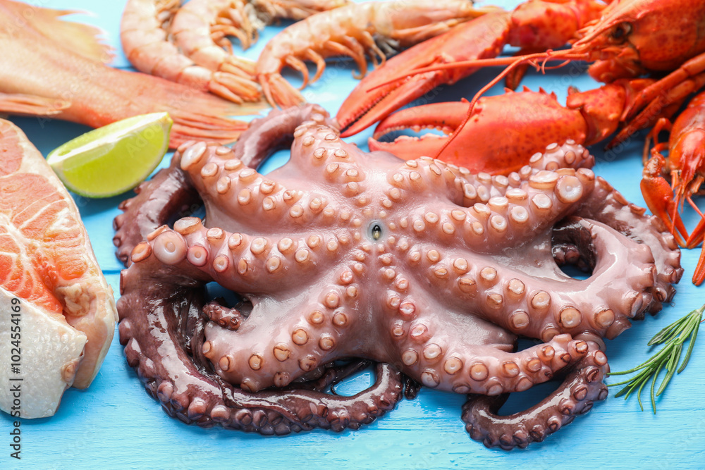 Different sea food on light blue wooden table, closeup Different sea food on light blue wooden table, closeup